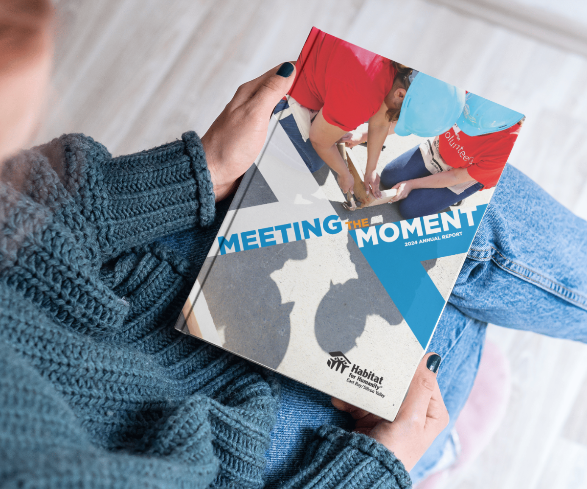 someone holding the 2024 Annual Report