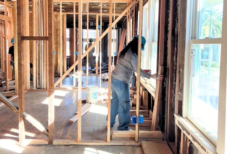 Volunteer framing at Habitat for Humanity construction site in San Jose.