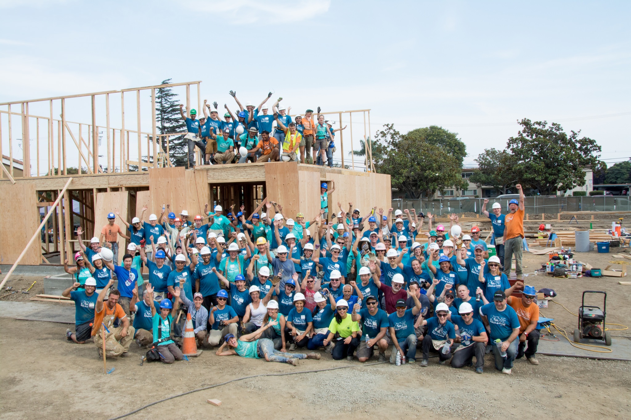 Volunteers building on a Habitat construction site.