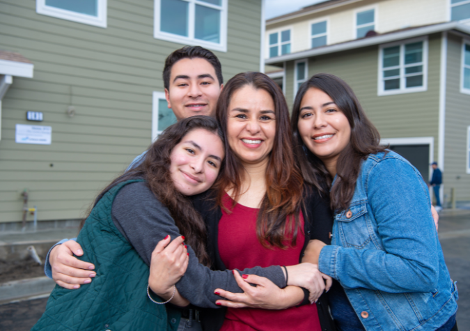 Family embracing their mother.