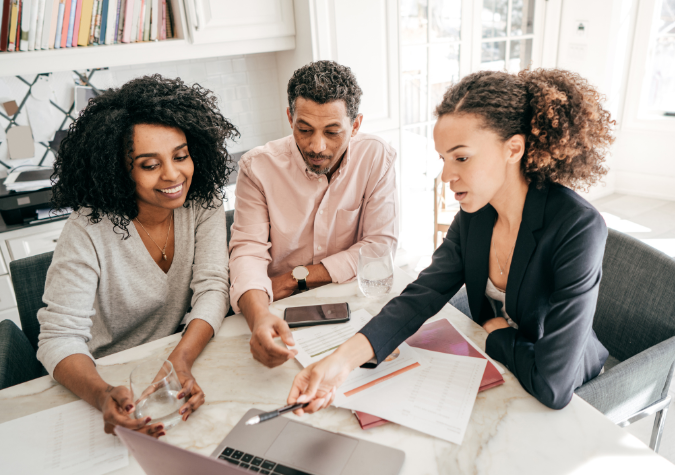 A couple working with a financial counselor.