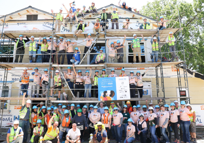 Habitat volunteers in front of home