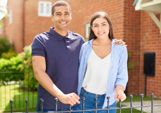First Time Homebuyers in front of home in the Bay Area